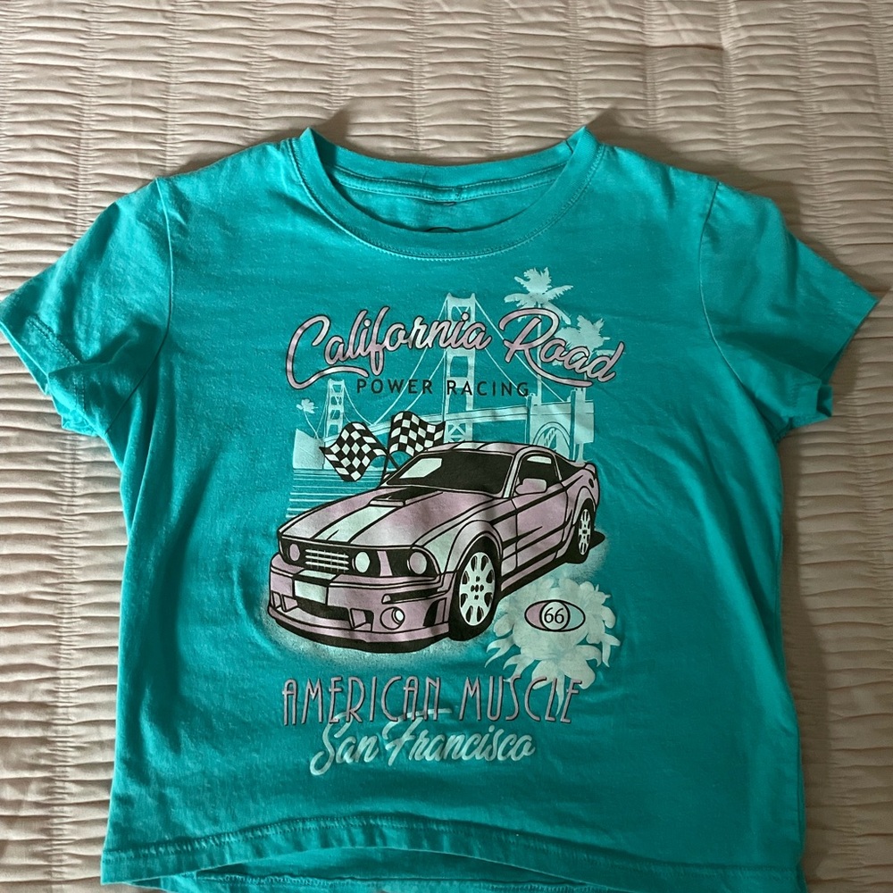 teal blue baby tee with super cute graphic design!💙🏁🏎️